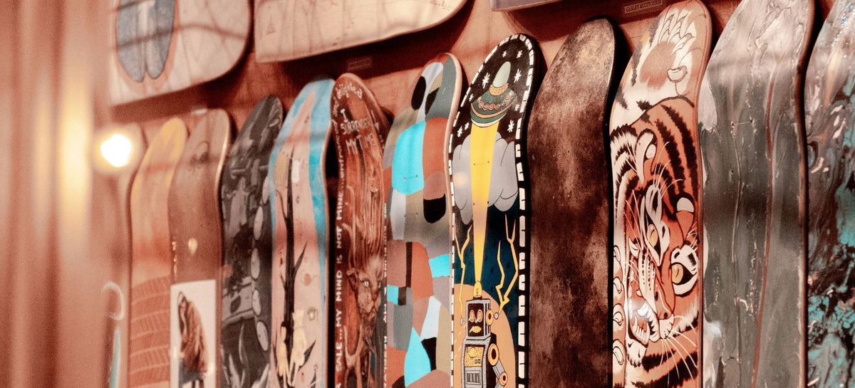 Wall of art skateboard decks in a skate shop